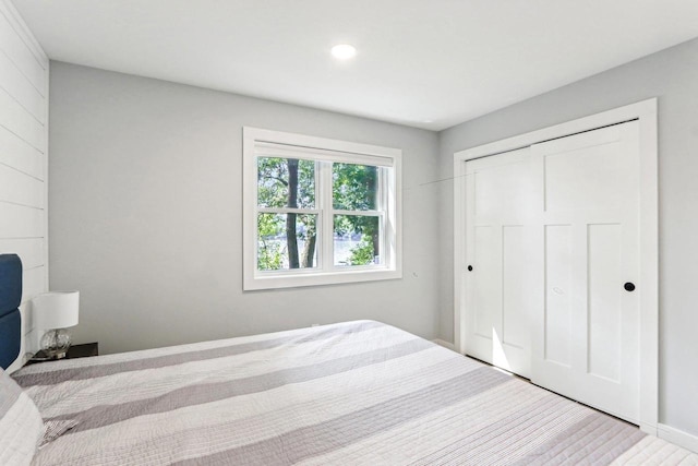 bedroom featuring a closet and wood finished floors