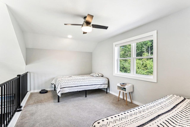 bedroom with carpet floors, baseboards, ceiling fan, and vaulted ceiling