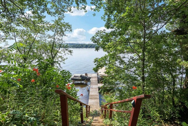 property view of water featuring a dock