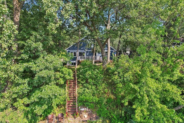 view of side of home featuring a deck and stairs