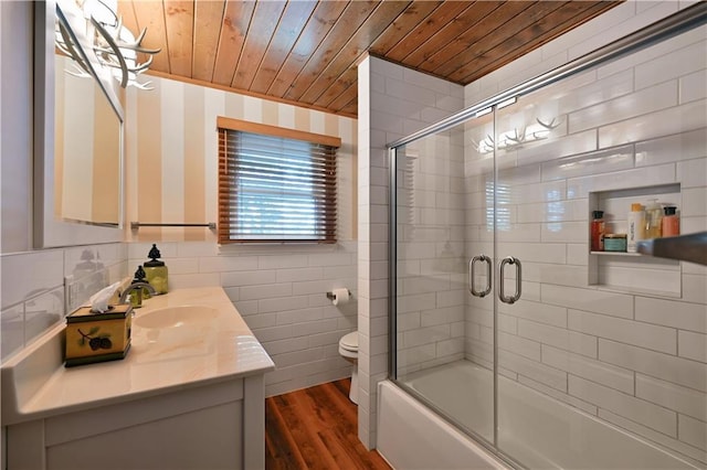 full bathroom featuring toilet, combined bath / shower with glass door, wooden ceiling, vanity, and hardwood / wood-style floors