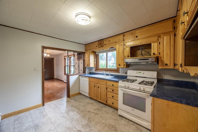 kitchen featuring sink, exhaust hood, light tile patterned floors, and white appliances