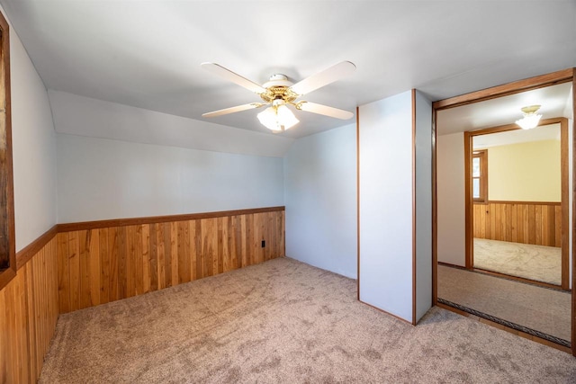 interior space featuring light carpet, a closet, and ceiling fan