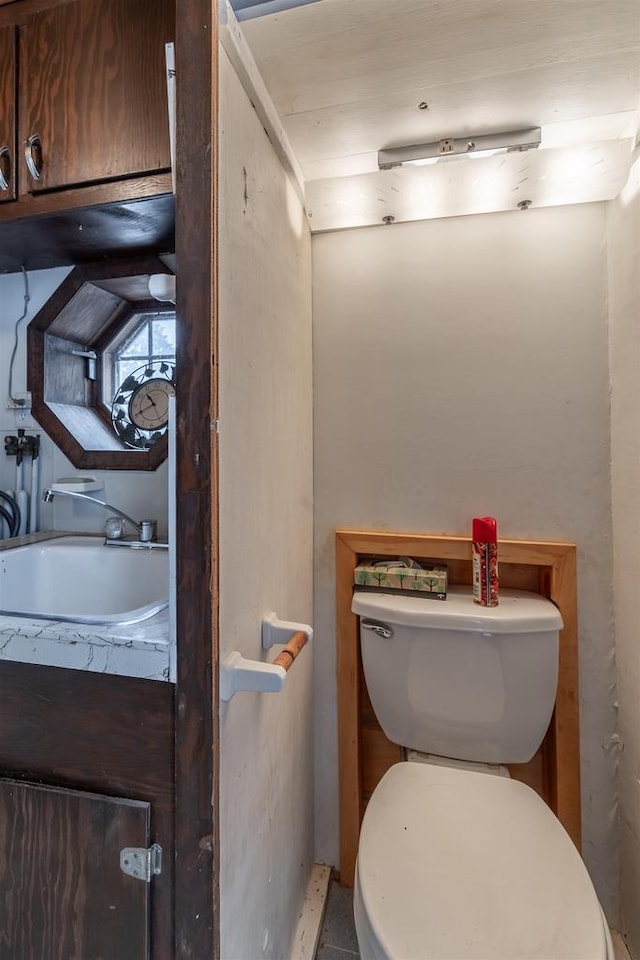 bathroom with sink and toilet