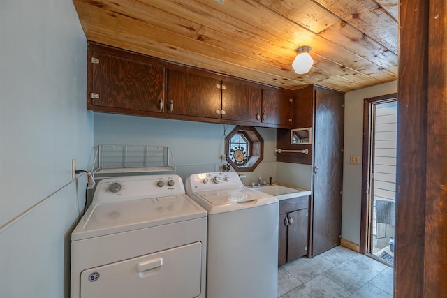 laundry room featuring sink, cabinets, light tile patterned floors, independent washer and dryer, and wooden ceiling