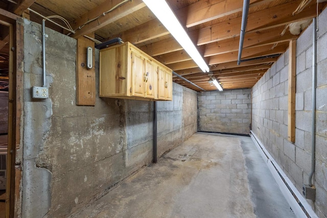 basement with a baseboard heating unit