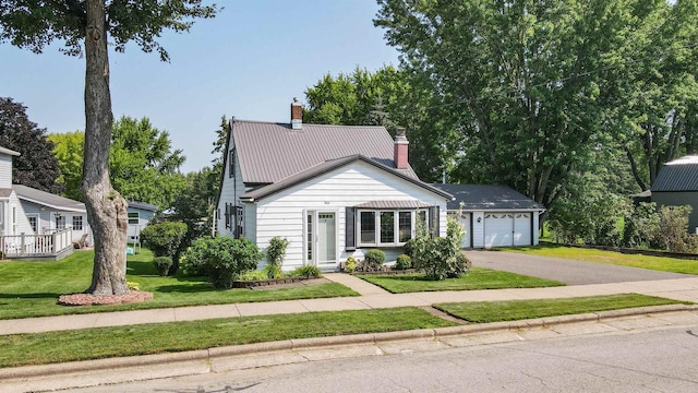 view of front facade featuring a garage and a front lawn