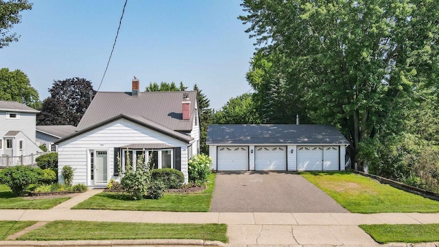 view of front of house featuring a garage and a front yard