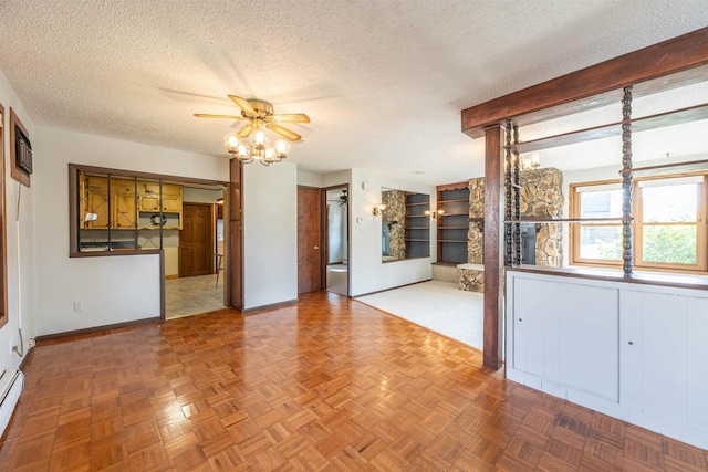 unfurnished living room with ceiling fan, a baseboard heating unit, a textured ceiling, and parquet floors