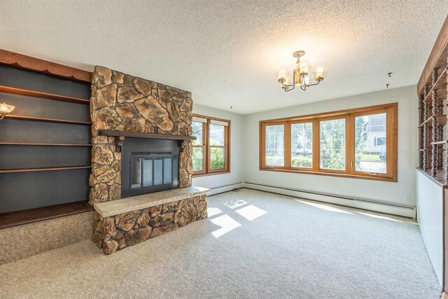 unfurnished living room with a chandelier, a textured ceiling, a baseboard radiator, a stone fireplace, and light carpet