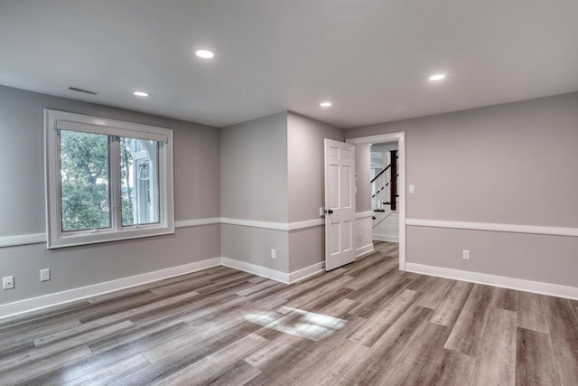 unfurnished room with light hardwood / wood-style flooring