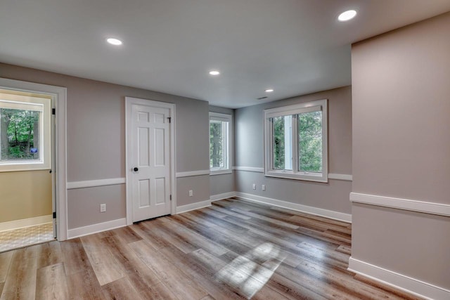 unfurnished bedroom with light wood-type flooring