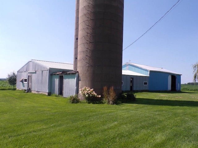 view of property exterior with a lawn