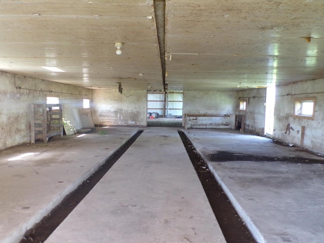 misc room with concrete flooring