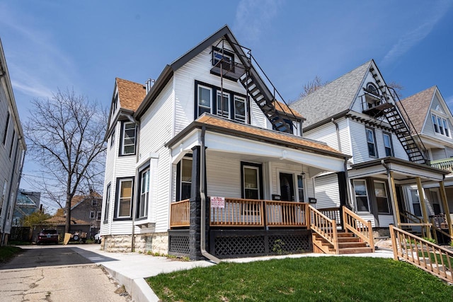 view of front of house featuring a front yard and a porch