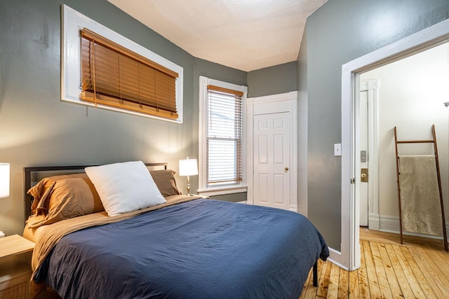 bedroom with light hardwood / wood-style flooring