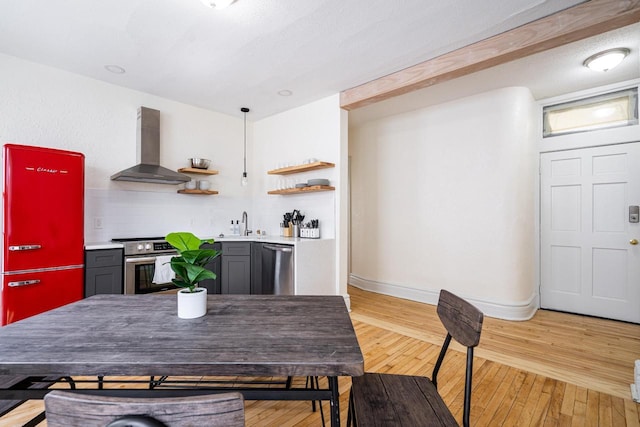 dining area featuring sink and light hardwood / wood-style flooring