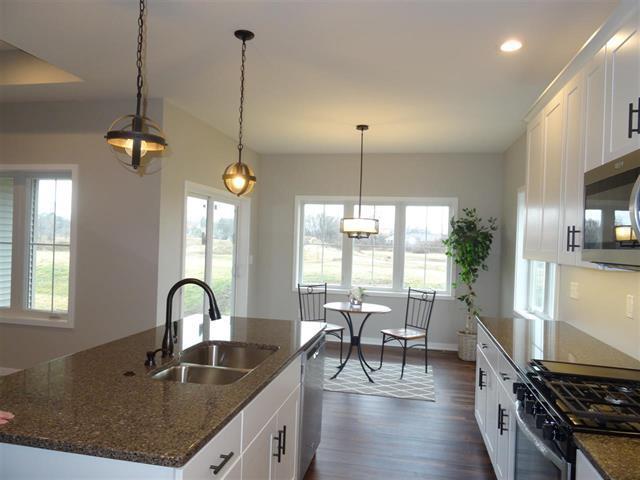 kitchen with white cabinetry, an island with sink, appliances with stainless steel finishes, and sink