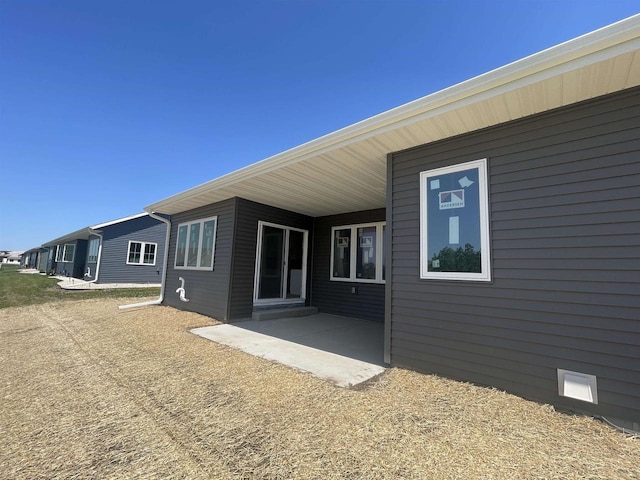 rear view of house featuring a patio area