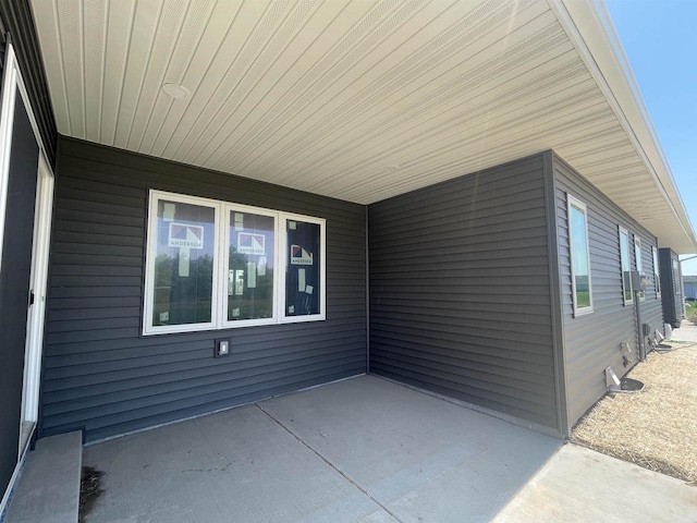 view of side of home featuring a patio