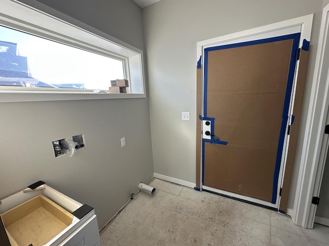 interior space featuring baseboards