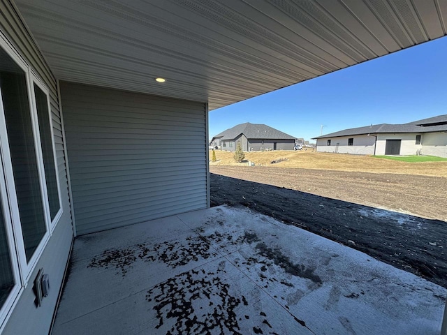 view of yard featuring a residential view and a patio area