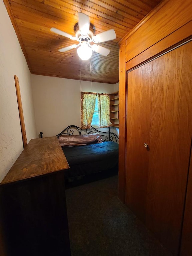 bedroom featuring wooden ceiling and ceiling fan