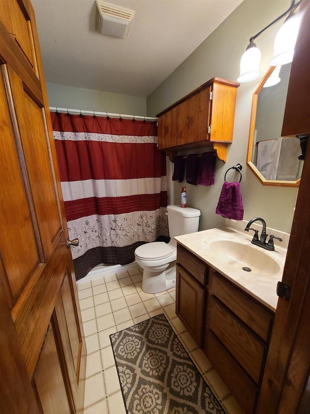 bathroom with vanity, a shower with curtain, and toilet