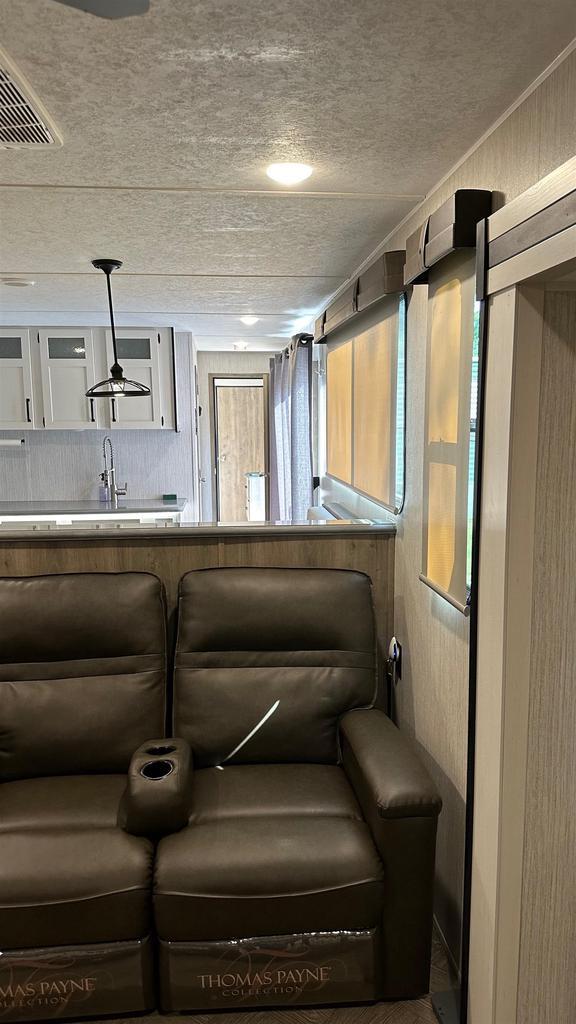 home theater featuring sink and a textured ceiling