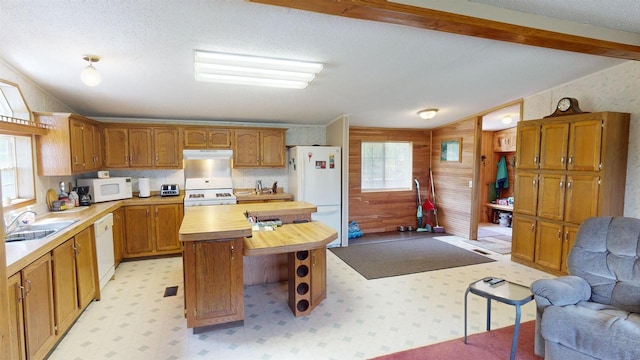 20649 Julia Rd, Clifton, WI 54618 - kitchen featuring sink, a center island, lofted ceiling with beams, plenty of natural light, and white appliances