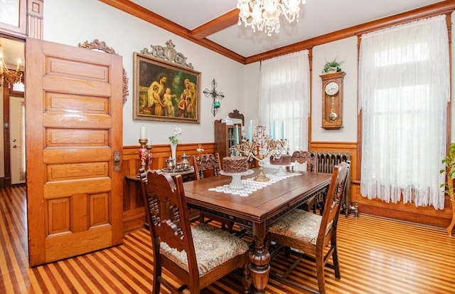 dining space featuring ornamental molding, a chandelier, and radiator heating unit