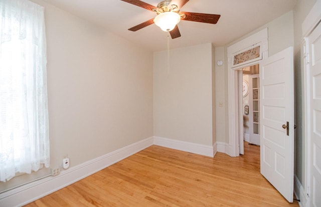 spare room featuring ceiling fan and light hardwood / wood-style flooring