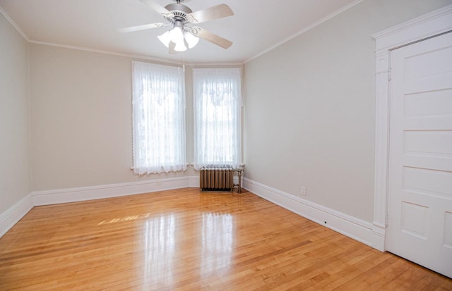 unfurnished room with crown molding, radiator heating unit, light hardwood / wood-style floors, and ceiling fan