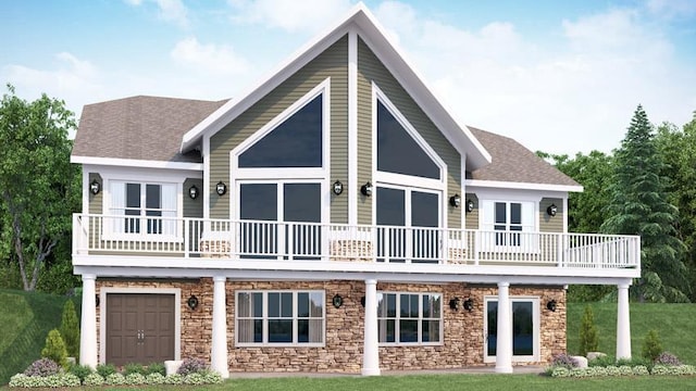 rear view of house featuring a garage and a lawn