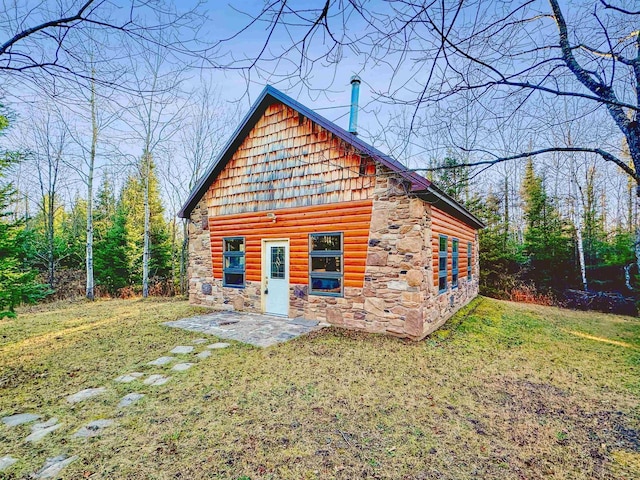 exterior space with a yard and a patio area