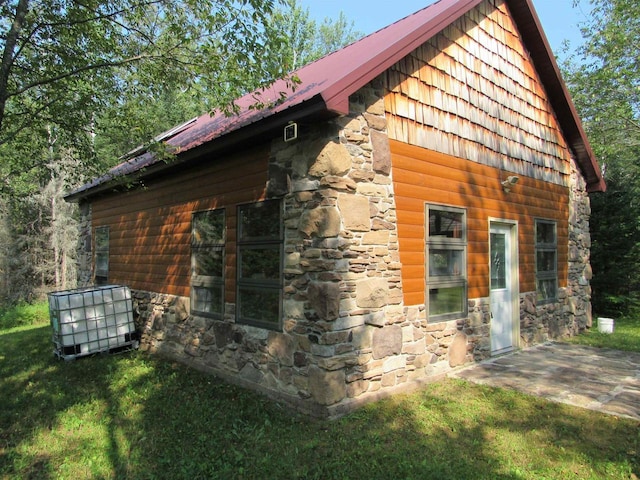 view of property exterior featuring a yard