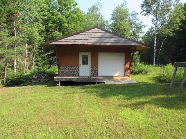 view of outdoor structure featuring a lawn