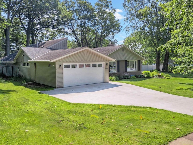 ranch-style home featuring a garage and a front yard