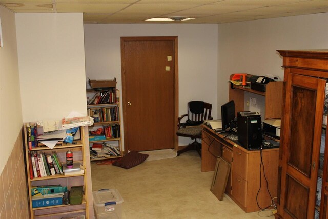 office with light carpet and a paneled ceiling