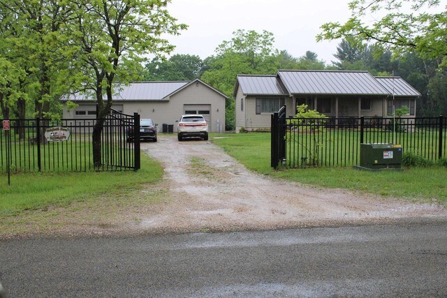 view of front of home featuring central AC unit and a front lawn