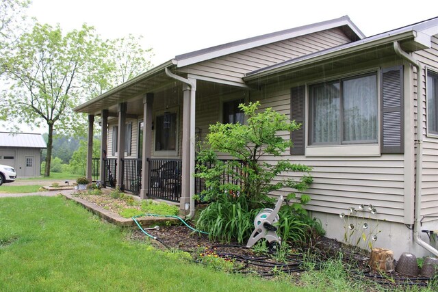 view of home's exterior with a yard