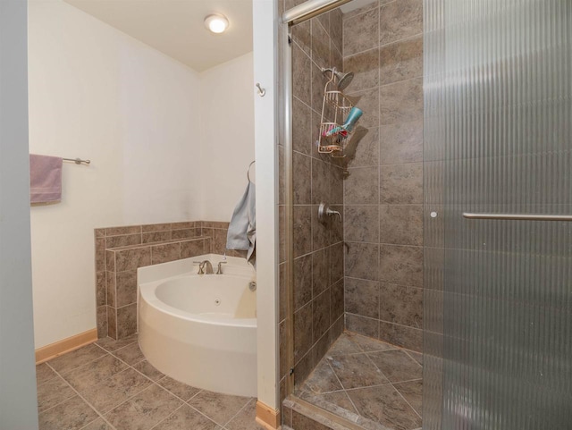 bathroom with tile patterned floors and separate shower and tub