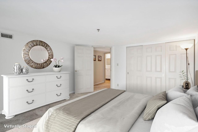 bedroom featuring carpet and a closet