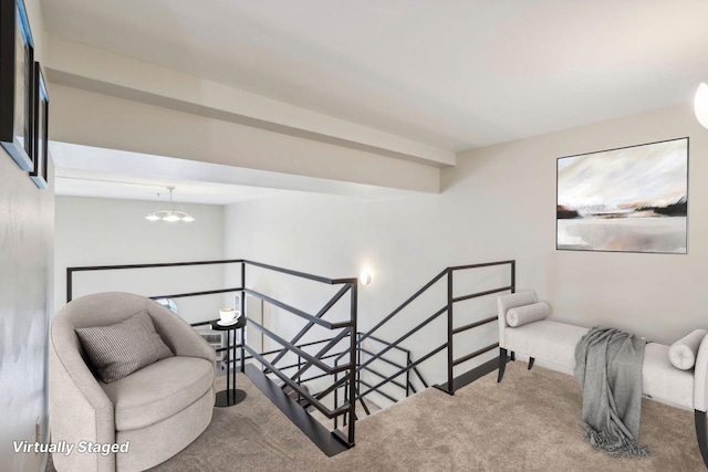 living area with a chandelier and carpet flooring