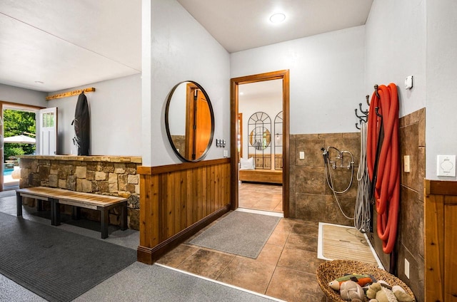 bathroom featuring walk in shower and tile patterned floors