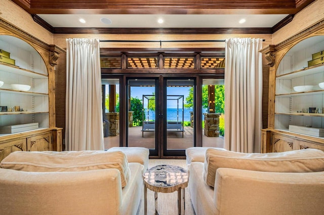 living area featuring ornamental molding and built in features