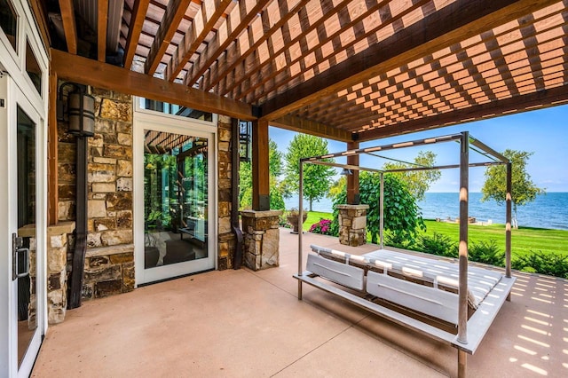 view of patio featuring a water view and a pergola