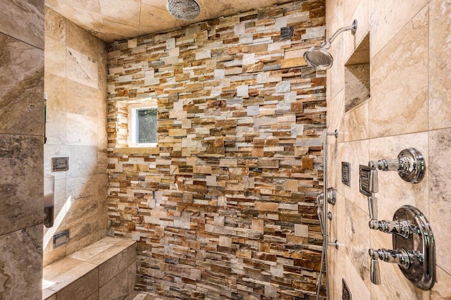 bathroom with tiled shower