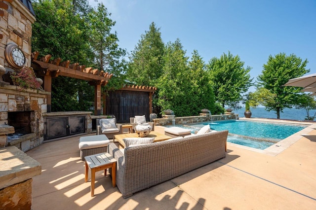 view of swimming pool with pool water feature, an outdoor living space with a fireplace, a pergola, and a patio