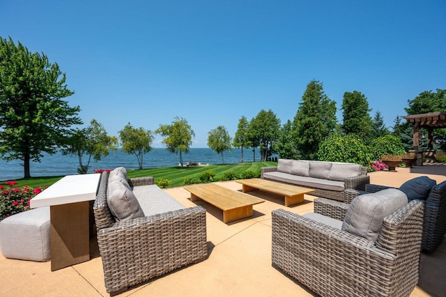 view of patio / terrace featuring a water view and an outdoor hangout area